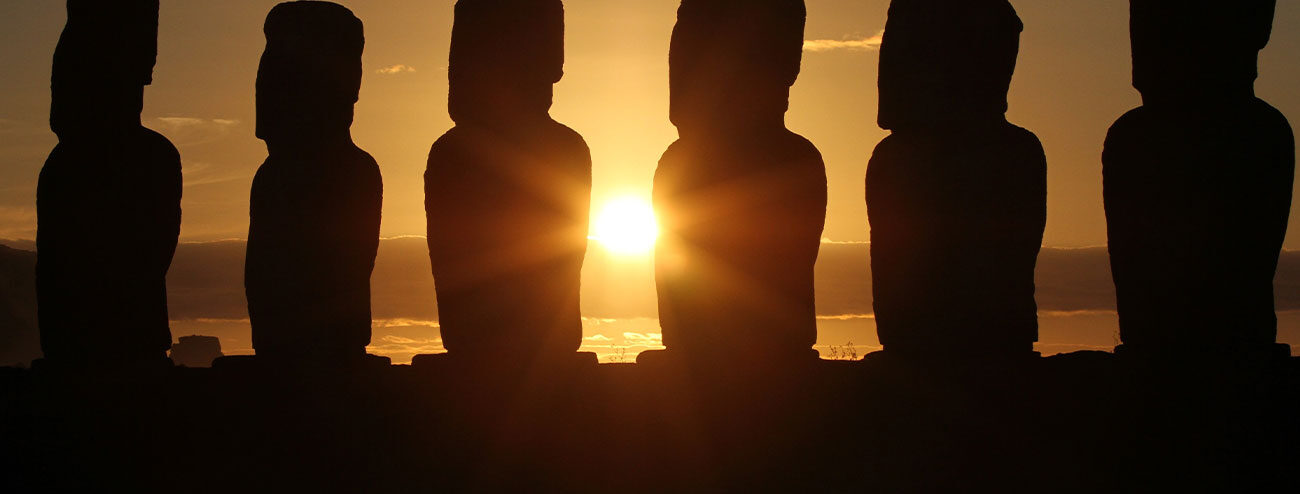 Standing On and Building the Shoulders of Giants - Picture shows Easter Island statues with the sun over the horizon between the middle of them.